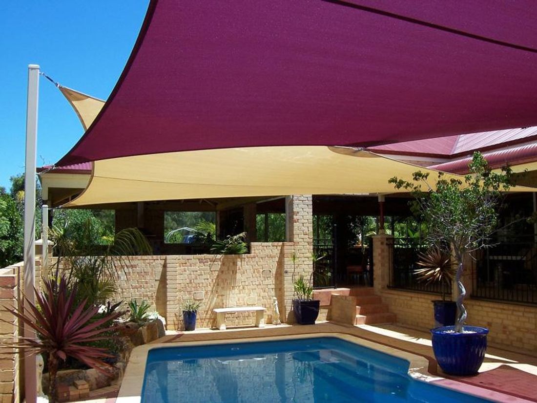 Creating shade with sails in the backyard