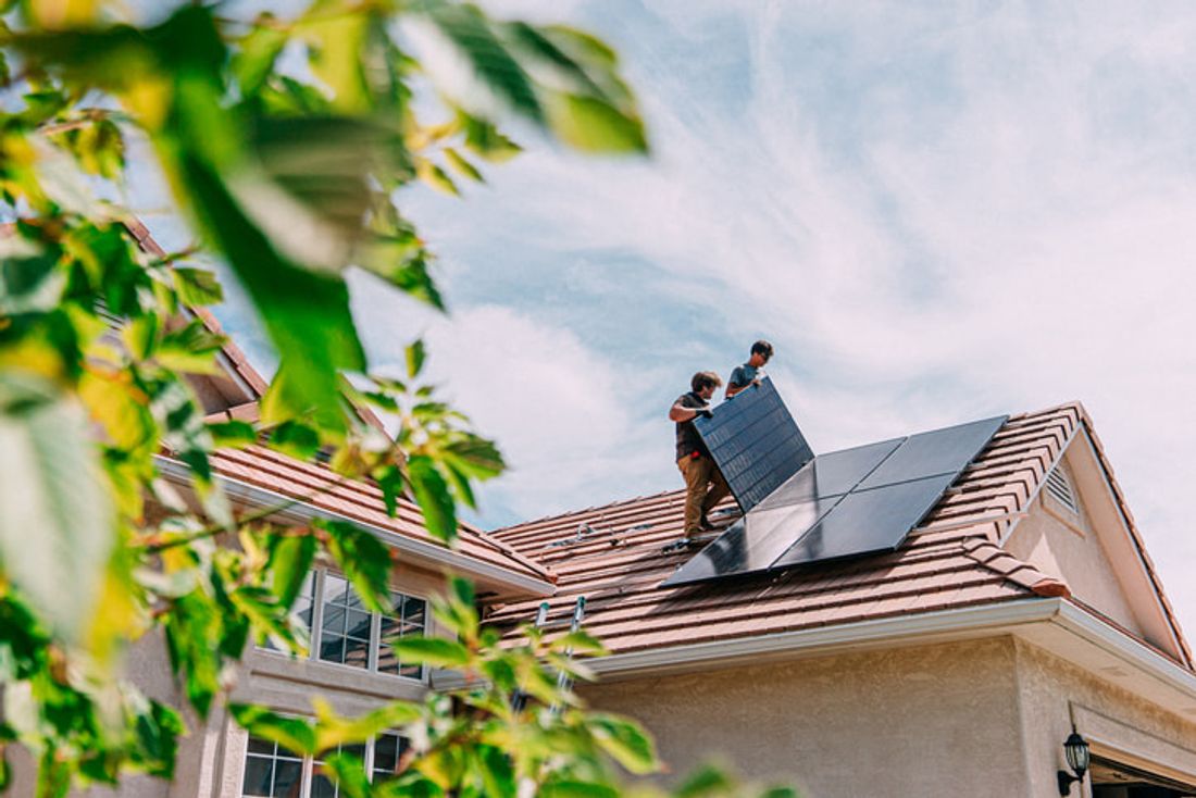 Technicians installing solar panels