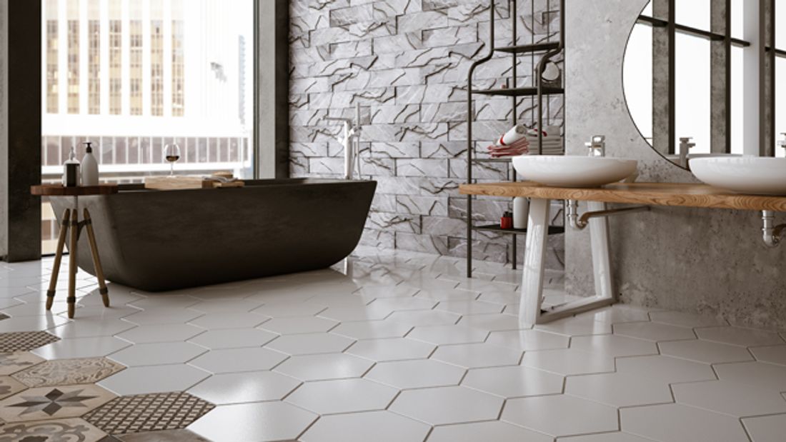 Modern bathroom with white and patterned hexagonal floor tiles