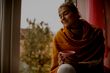 calm woman looking comfortable and warm in her home